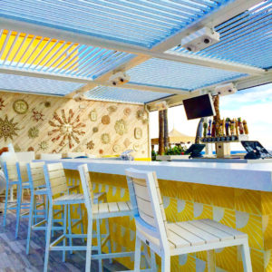 A bar covered by a motorized pergola.