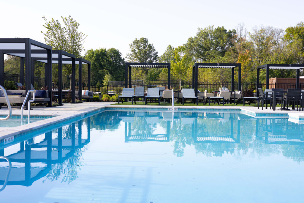 StruXure Cabana X structure over commercial pool — flexible shade and privacy solution