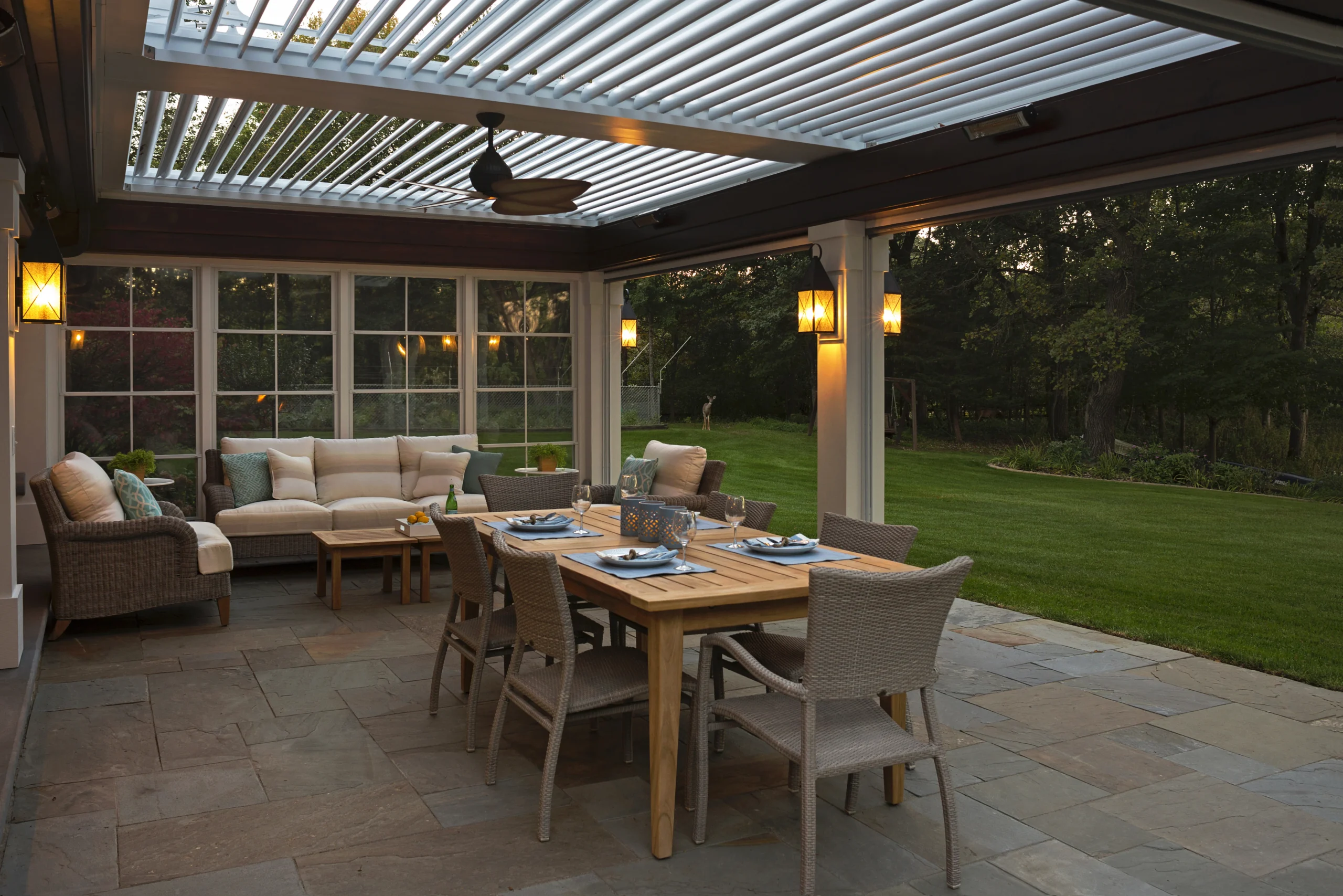 Screened outdoor room with an aluminum louvered roof where a pergola motor replacement would be serviced