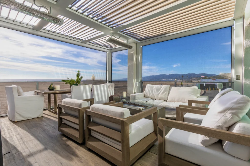 StruXure louvered pergola with a motorized screen system deployed over a South Florida residential patio