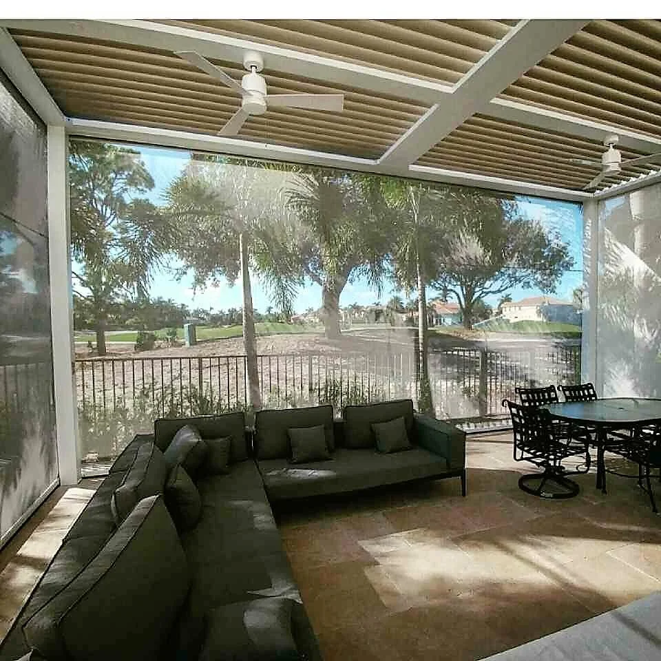 Retractable screen panel in open position on a StruXure pergola terrace with a clear outdoor view