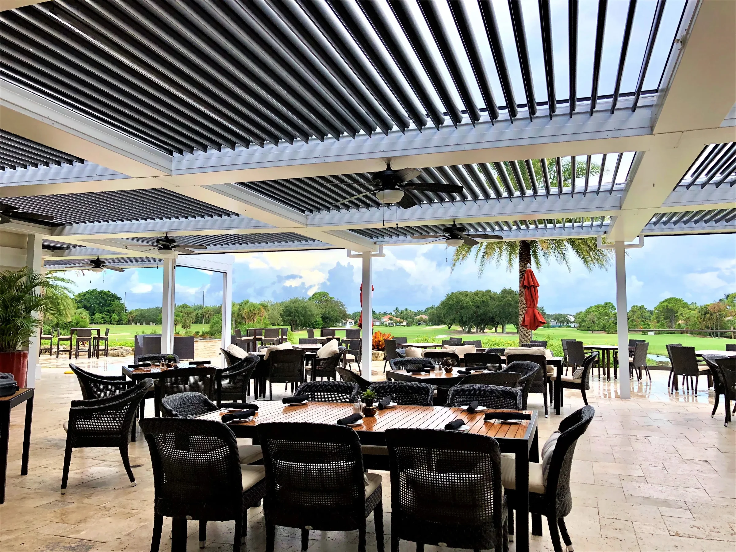 StruXure commercial pergola at Admirals Cove Country Club outdoor lounge with louvered roof