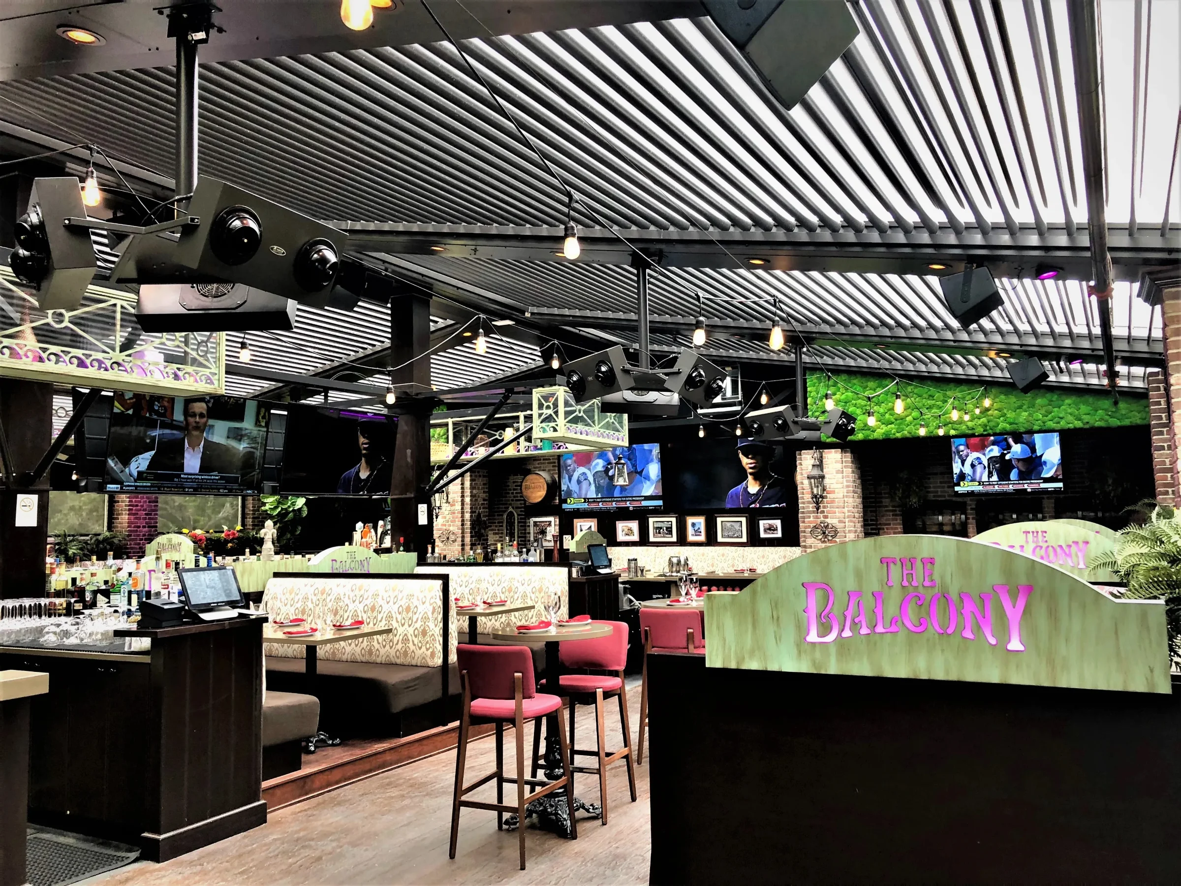 Pergola condensation forms on the underside of closed aluminum louvers like these over a Fort Lauderdale bar