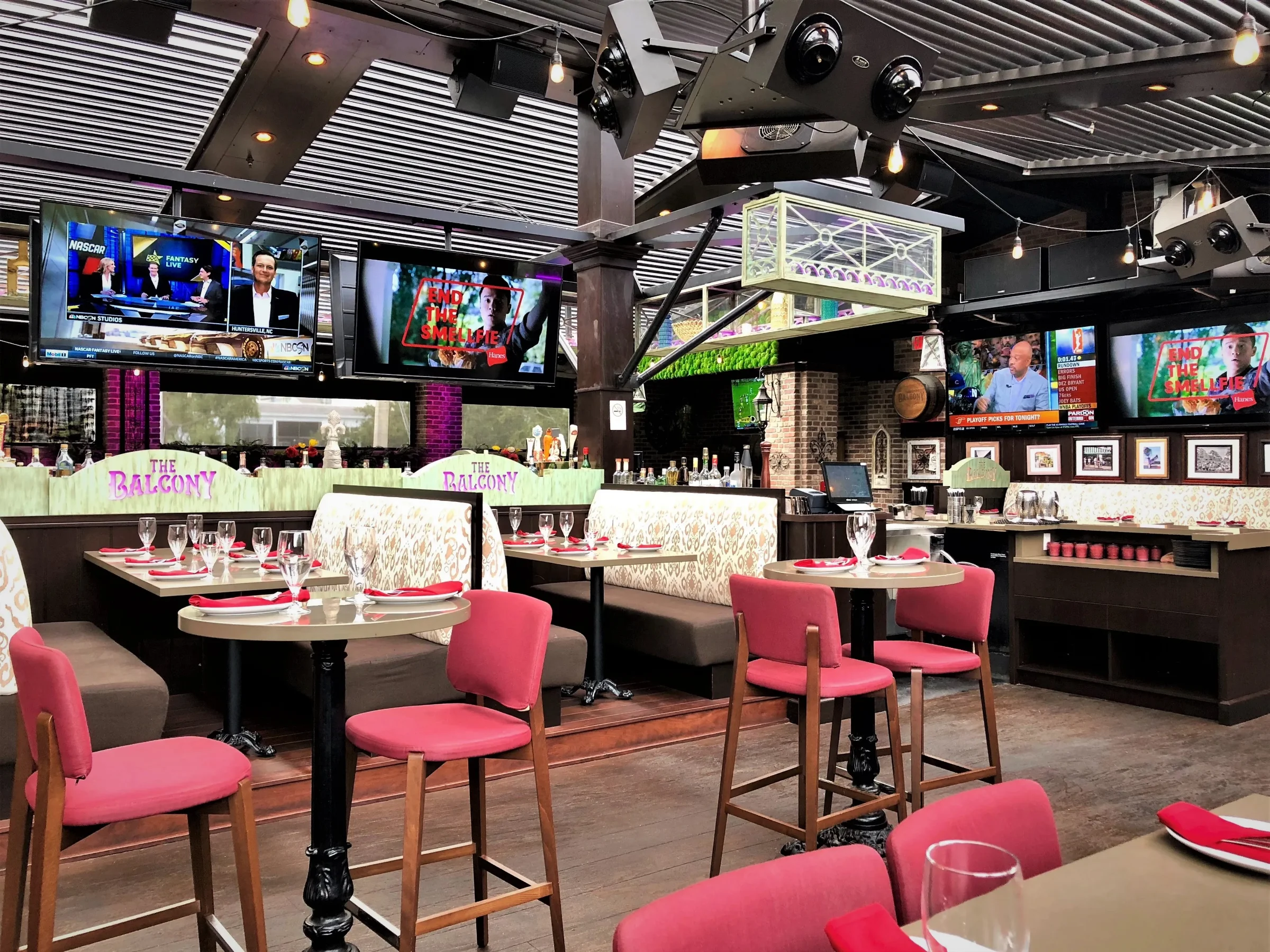 Bar seating and screens beneath an operable louvered roof at a Las Olas venue in Fort Lauderdale
