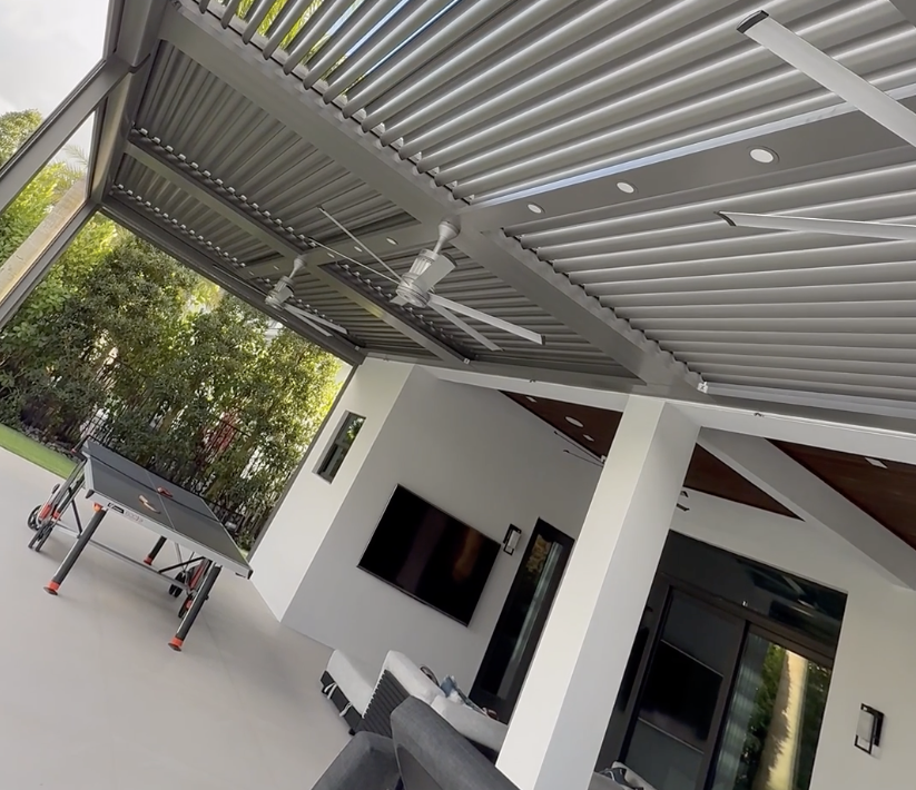 Underside of a louvred roof showing pergola fasteners at blade and beam connections