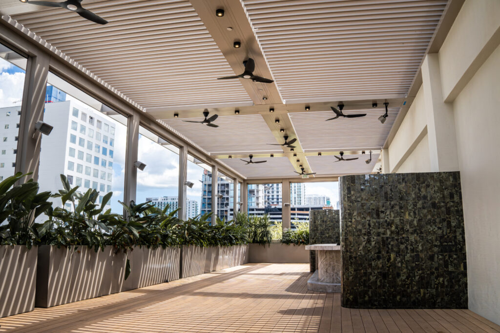 Motorized louvered pergola over an outdoor living area in South Florida