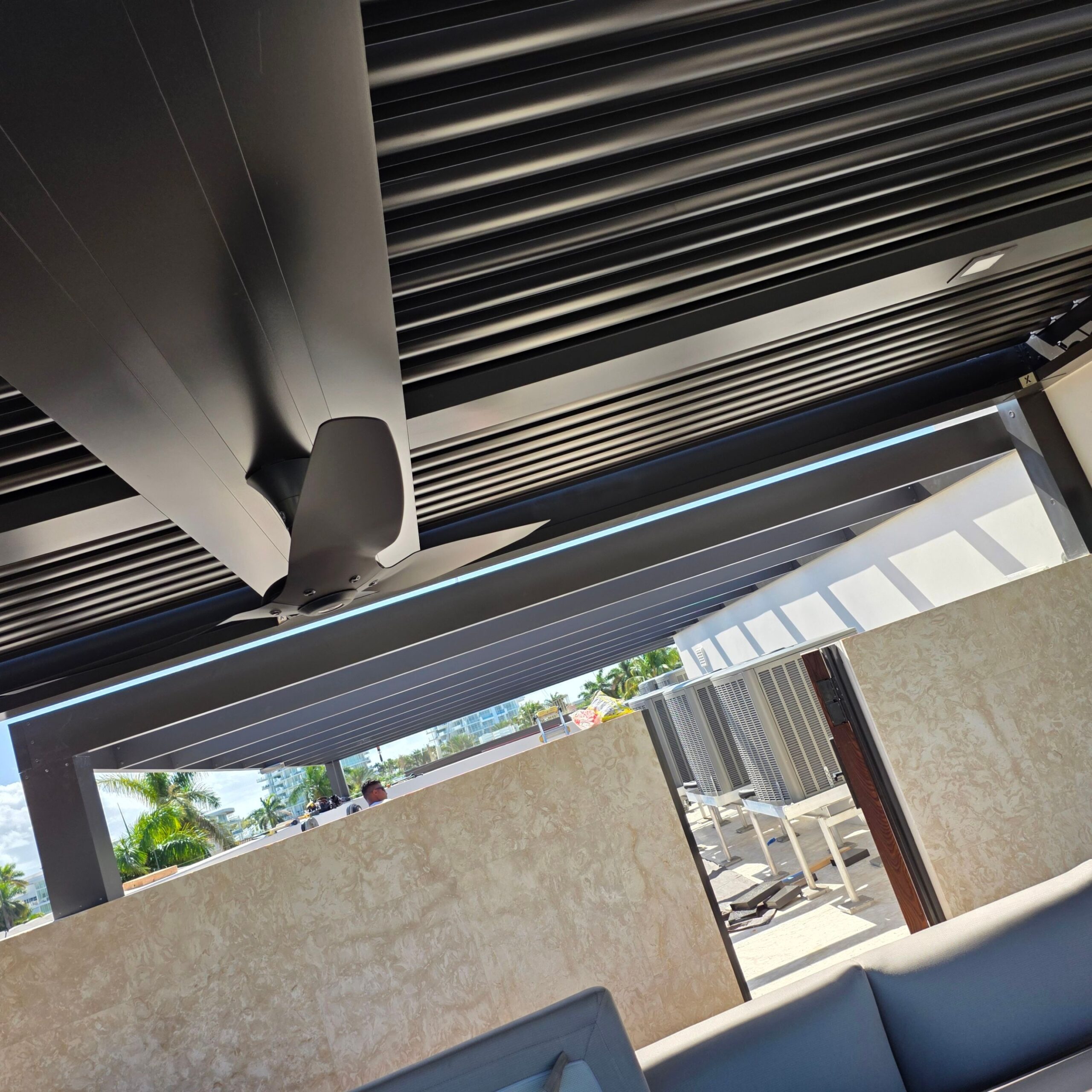 Close-up of pergola fasteners at a louvre blade and post connection in South Florida