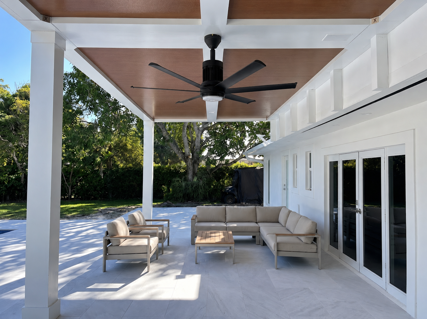 Wood-grain aluminium ceiling under a white louvered pergola replacing an old timber structure
