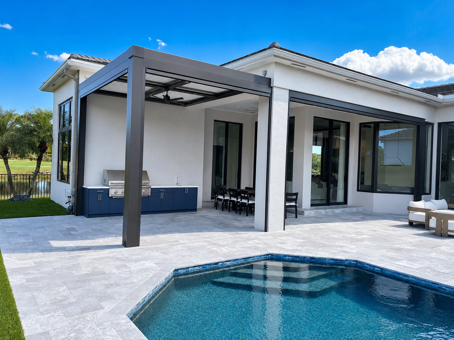 Dark louvered pergola over a poolside patio covered under Florida pergola insurance