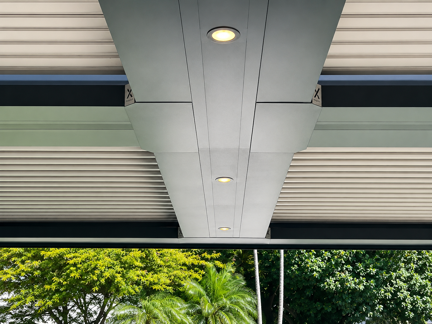 Underside of a closed louvered aluminium roof with integrated lighting, illustrating the ceiling condition when louvers are shut