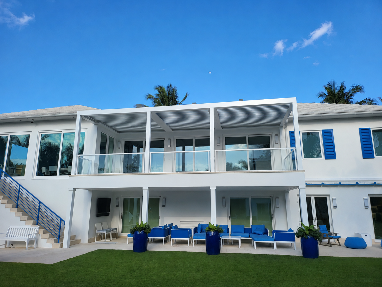 Multi-level South Florida residence with covered outdoor living areas relevant to pergola insurance limits
