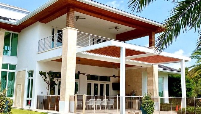 White home with louvered pergola in Delray Beach